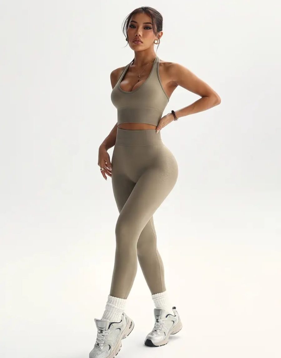 Woman wearing the khaki 2-piece halter athletic set